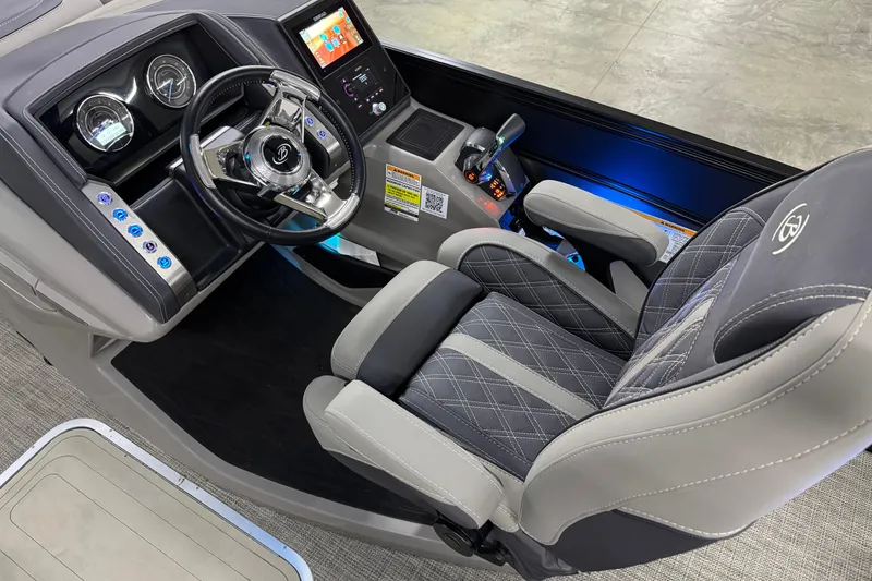 Slide: The Image of 2023 Barletta LUSSO 25U boat cockpit with luxury steering and control panel. - 21