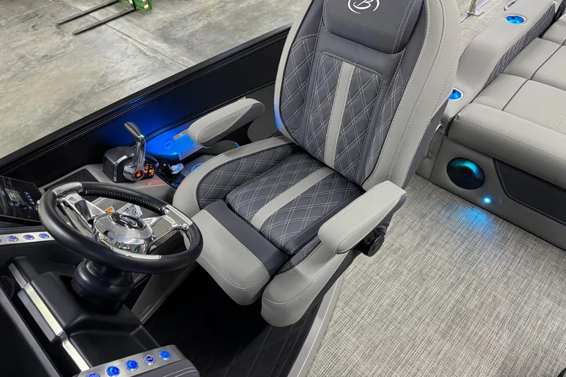 Slide: The Image of 2023 Barletta LUSSO 25U boat interior with luxury seating and modern controls. - 23