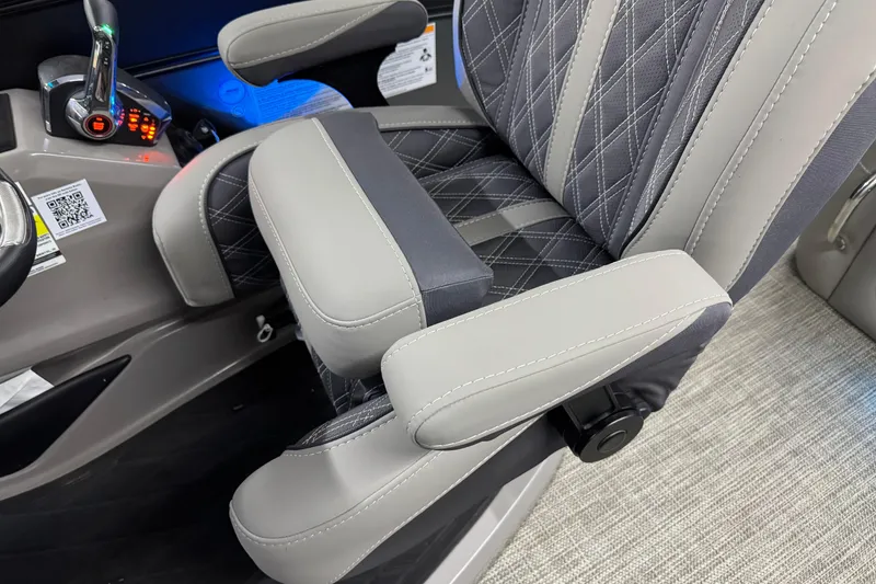 Slide: The Image of 2023 Barletta LUSSO 25U captain's chair with elegant stitching and armrests. - 24