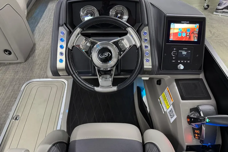 Slide: The Image of 2023 Barletta LUSSO 25U dashboard with steering wheel and digital display. - 26