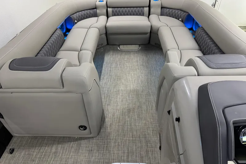 Slide: The Image of 2023 Barletta LUSSO 25U interior with luxurious gray seating and blue accent lighting. - 28