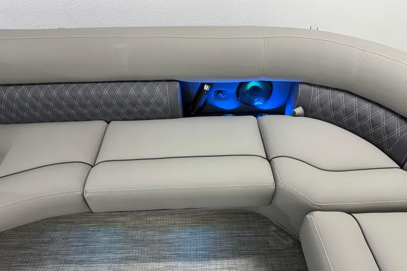 Slide: The Image of 2023 Barletta LUSSO 25U boat interior with luxurious seating and ambient blue lighting. - 31