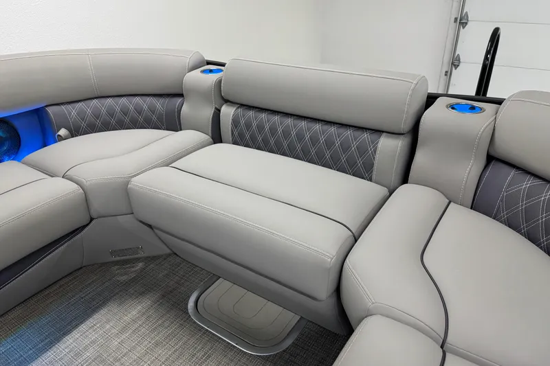 Slide: The Image of 2023 Barletta LUSSO 25U boat interior with luxurious gray seating and blue cup holders. - 33