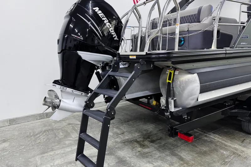 Slide: The Image of 2023 Barletta LUSSO 25U pontoon boat with Mercury Verado engine and boarding ladder. - 5