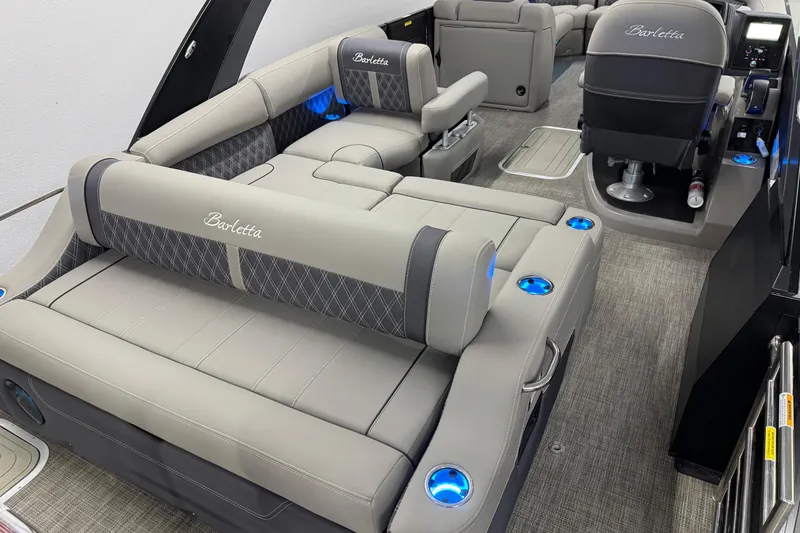 Slide: The Image of 2023 Barletta LUSSO 25U interior with luxurious seating and ambient lighting. - 6