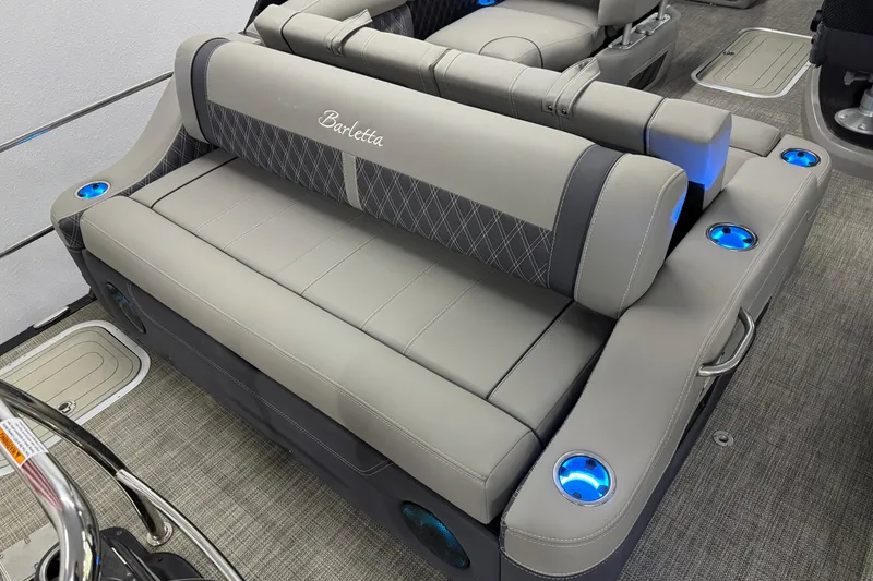 Slide: The Image of 2023 Barletta LUSSO 25U boat interior with luxurious seating and illuminated cup holders. - 8