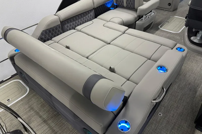 Slide: The Image of 2023 Barletta LUSSO 25U boat interior with luxurious seating and illuminated cup holders. - 9