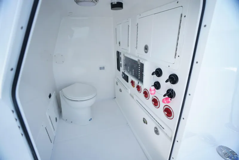 Slide: The Image of 2023 SeaHunter 41 CTS boat interior with control panel and toilet. - 17