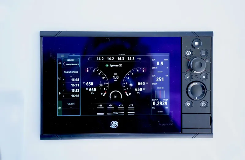 Slide: The Image of Digital control panel of 2023 SeaHunter 41 CTS boat, displaying engine and system information. - 18