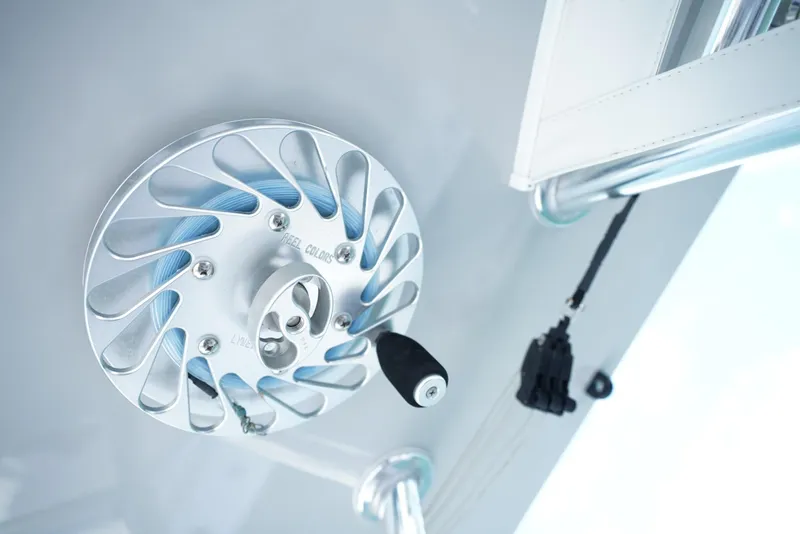 Slide: The Image of Close-up of a 2023 SeaHunter 41 CTS boat's reel mechanism, showcasing sleek design and engineering. - 19