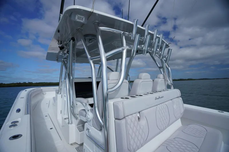 Slide: The Image of 2023 SeaHunter 41 CTS boat with sleek design and modern features on open water. - 6