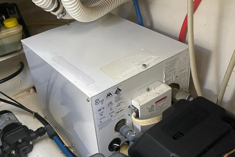 Slide: The Image of Engine compartment of 2007 Bayliner 245 Ciera with visible mechanical components. - 10