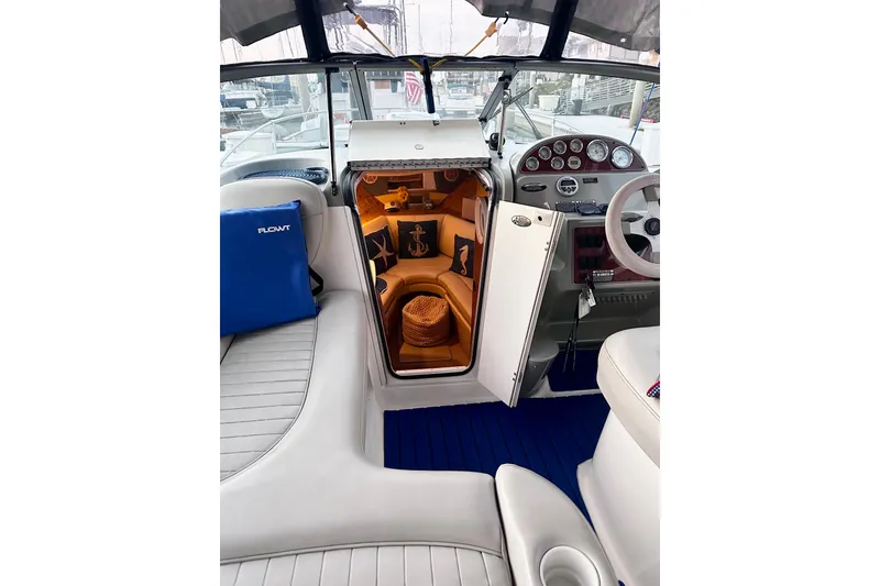Slide: The Image of 2007 Bayliner 245 Ciera boat interior with cozy cabin and nautical decor. - 3