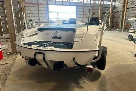 Slide: The Image of 2003 Yamaha Boats LS2000 in storage, rear view in a warehouse setting. - 4