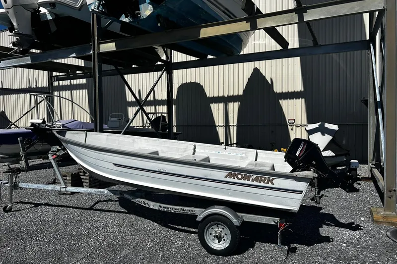 Slide: The Image of 1997 Monark SF 14 S boat on trailer in storage facility. - 2