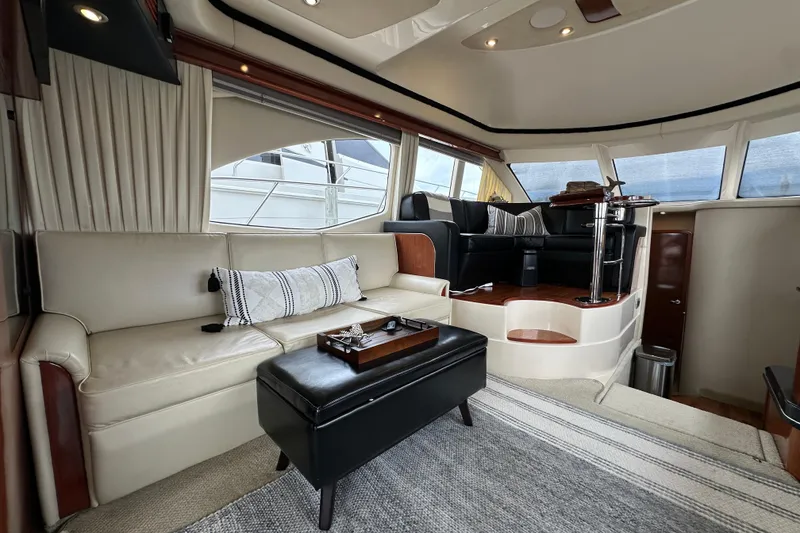 Slide: The Image of Luxurious interior of 2004 Sea Ray 420 Sedan Bridge yacht with elegant seating and modern design. - 14