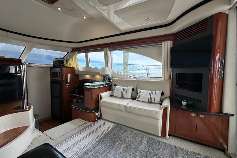 Slide: The Image of Luxurious interior of 2004 Sea Ray 420 Sedan Bridge yacht with elegant seating and modern amenities. - 15