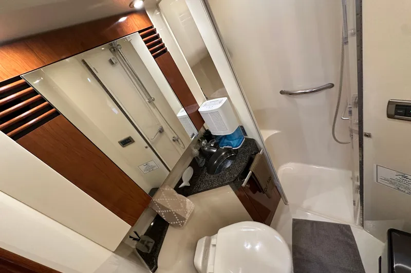 Slide: The Image of Luxurious bathroom interior of 2004 Sea Ray 420 Sedan Bridge yacht. - 23