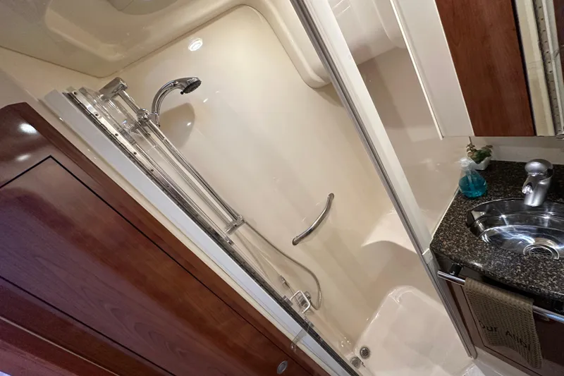 Slide: The Image of Luxurious bathroom in 2004 Sea Ray 420 Sedan Bridge yacht with modern fixtures. - 26