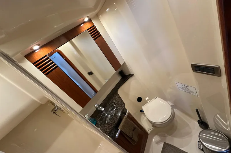 Slide: The Image of Luxurious bathroom in 2004 Sea Ray 420 Sedan Bridge yacht with modern amenities. - 27