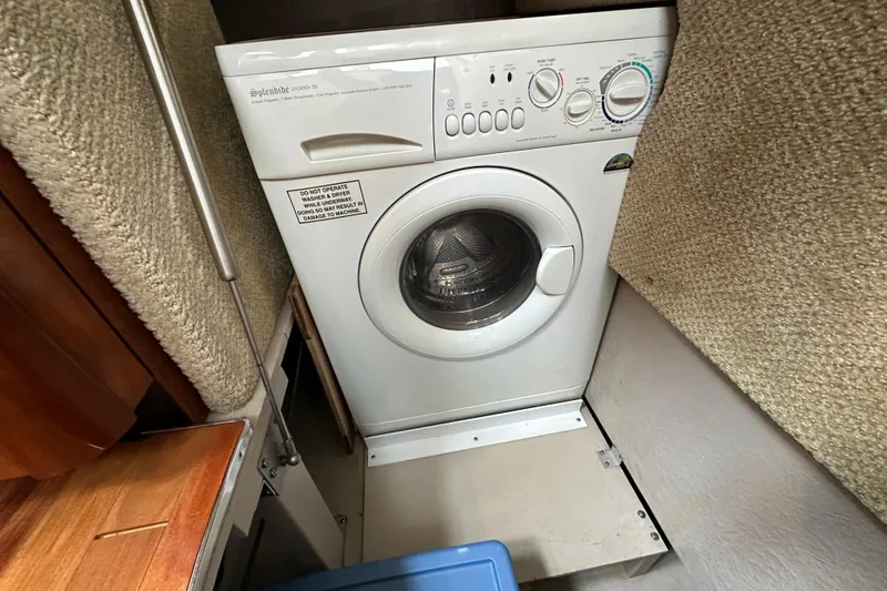 Slide: The Image of Washing machine in 2004 Sea Ray 420 Sedan Bridge yacht interior. - 30