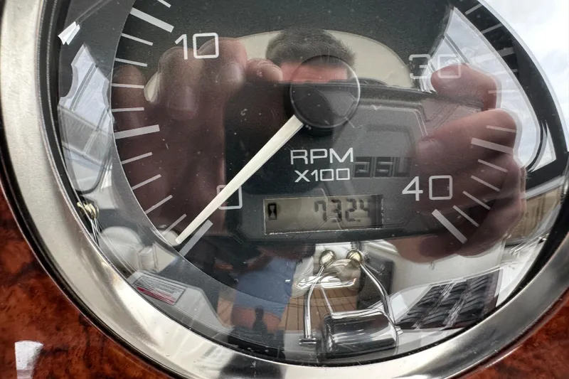 Slide: The Image of Close-up of a 2004 Sea Ray 420 Sedan Bridge RPM gauge showing 732.4 hours. - 37
