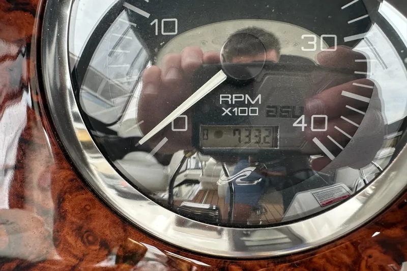Slide: The Image of Close-up of 2004 Sea Ray 420 Sedan Bridge RPM gauge showing 733.2 hours. - 38