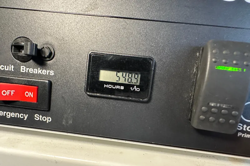 Slide: The Image of Control panel of a 2004 Sea Ray 420 Sedan Bridge showing 5489 hours. - 39