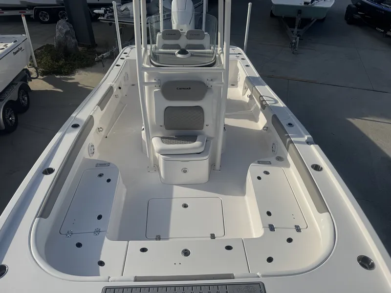 Slide: The Image of 2025 Caymas HB 28 boat interior, featuring spacious deck and seating area. - 7