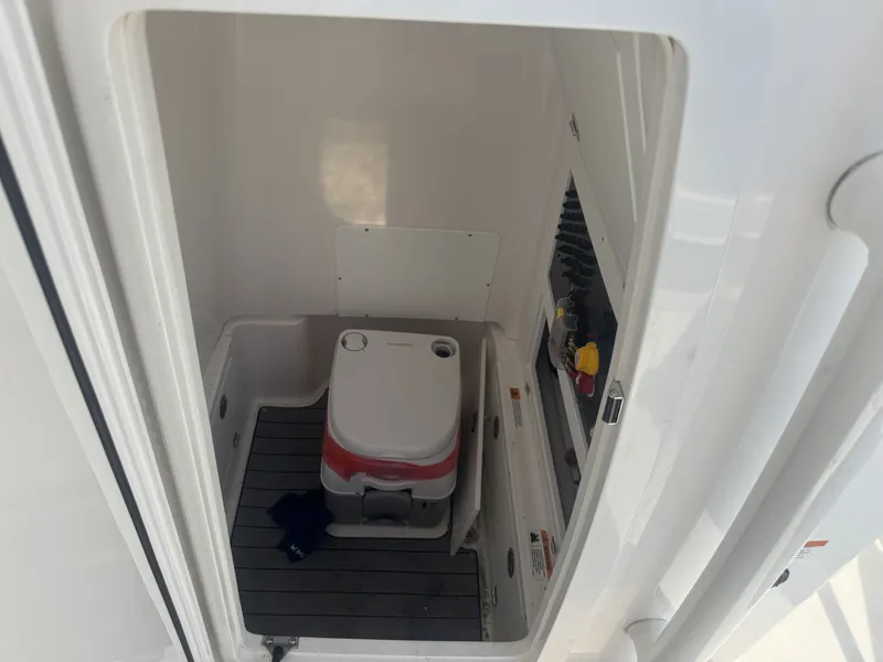 Slide: The Image of 2025 Caymas HB 28 boat interior with compact marine toilet. - 8