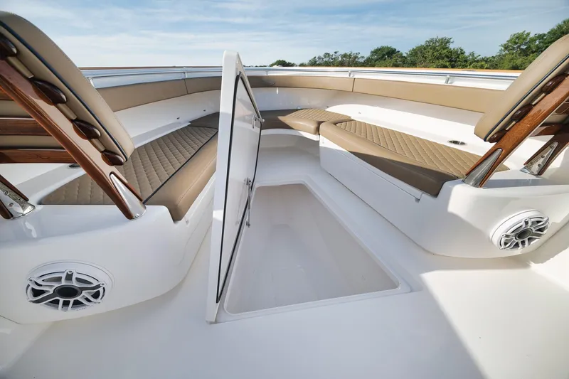 Slide: The Image of 2022 Valhalla Boatworks V-41 interior with cushioned seating and storage compartment. - 18
