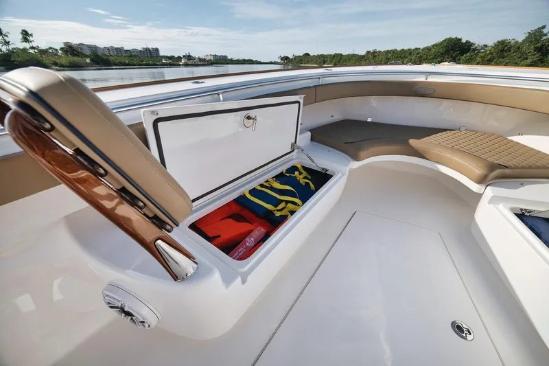 Slide: The Image of 2022 Valhalla Boatworks V-41 interior with open storage compartment and seating. - 20