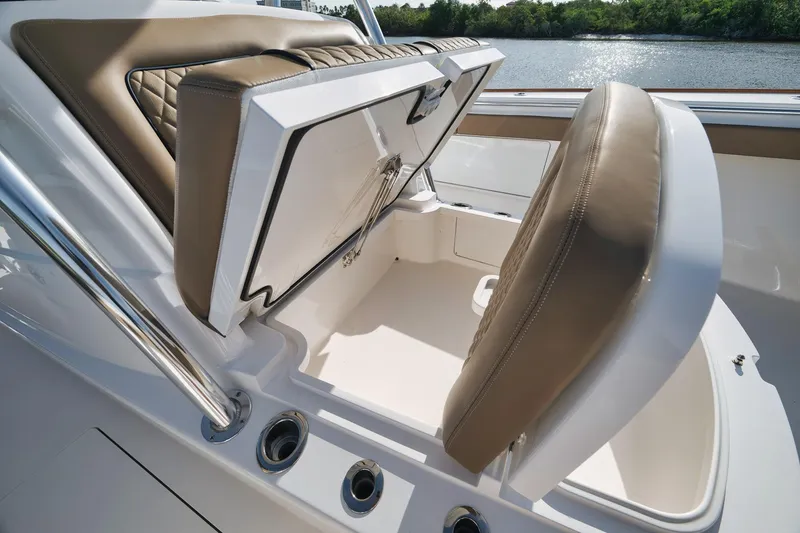 Slide: The Image of 2022 Valhalla Boatworks V-41 interior seating with storage compartment open. - 26