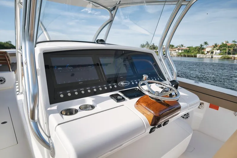 Slide: The Image of 2022 Valhalla Boatworks V-41 helm with modern controls and scenic water view. - 36