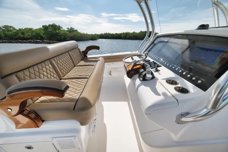 Slide: The Image of 2022 Valhalla Boatworks V-41 interior with luxurious seating and advanced navigation system. - 39