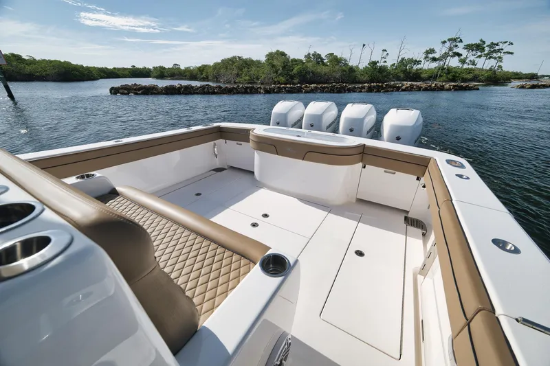 Slide: The Image of 2022 Valhalla Boatworks V-41, spacious deck, luxurious seating, scenic water backdrop. - 46