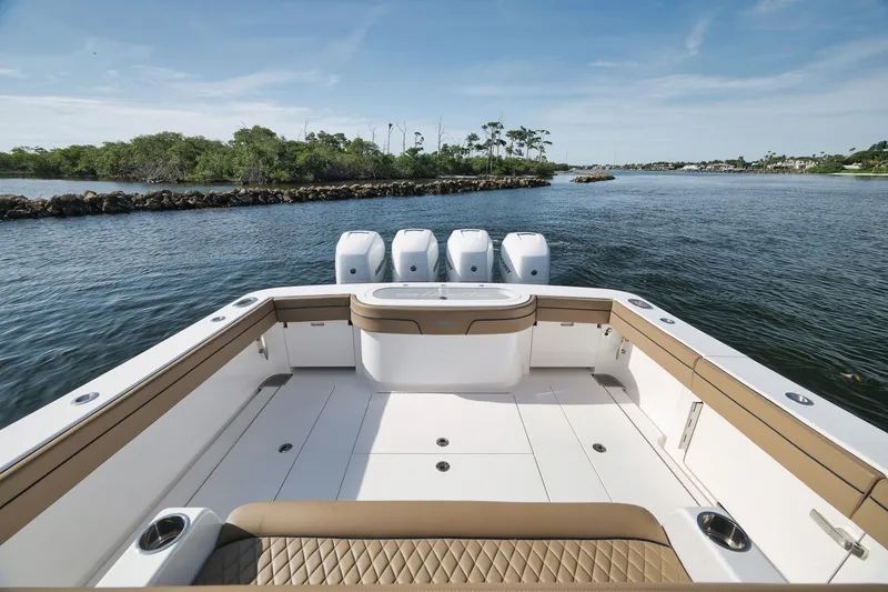 Slide: The Image of 2022 Valhalla Boatworks V-41 on water, featuring spacious deck and quad engines. - 47