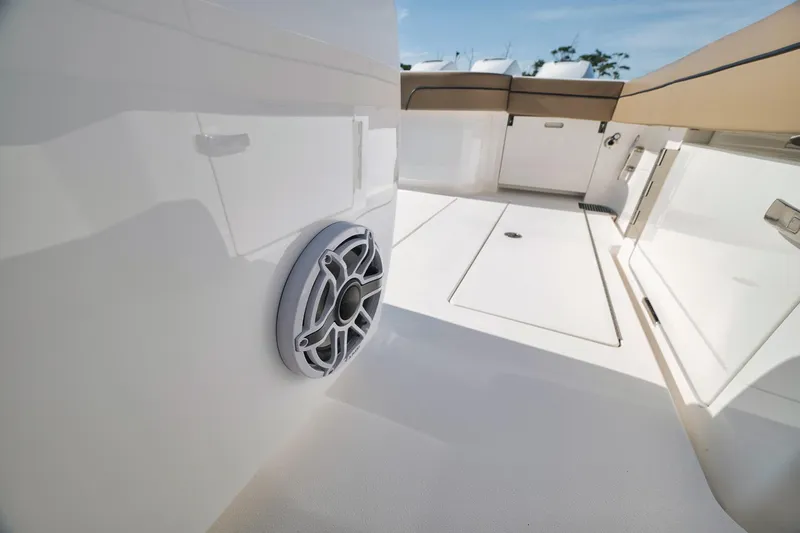 Slide: The Image of 2022 Valhalla Boatworks V-41 interior, featuring sleek white design and modern speaker system. - 48