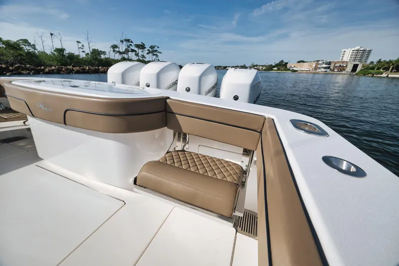 Slide: The Image of 2022 Valhalla Boatworks V-41 with luxurious seating and powerful engines on a serene waterway. - 54