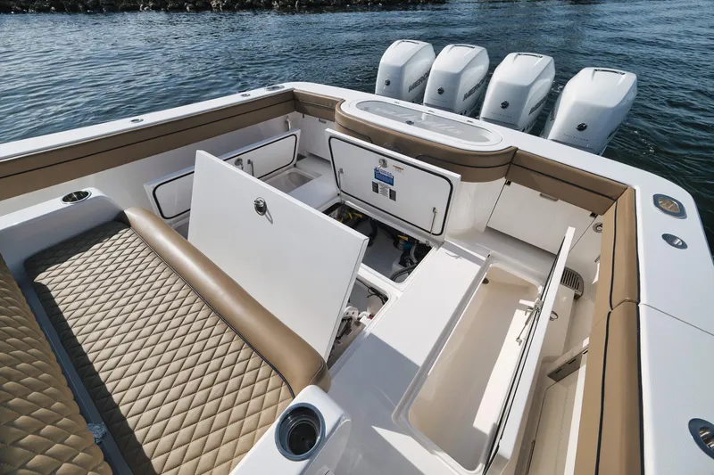 Slide: The Image of 2022 Valhalla Boatworks V-41 interior with open storage compartments and quad Mercury engines. - 55