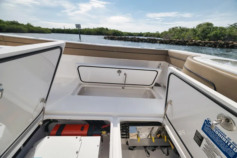 Slide: The Image of 2022 Valhalla Boatworks V-41 interior storage compartments on a sunny day by the water. - 57