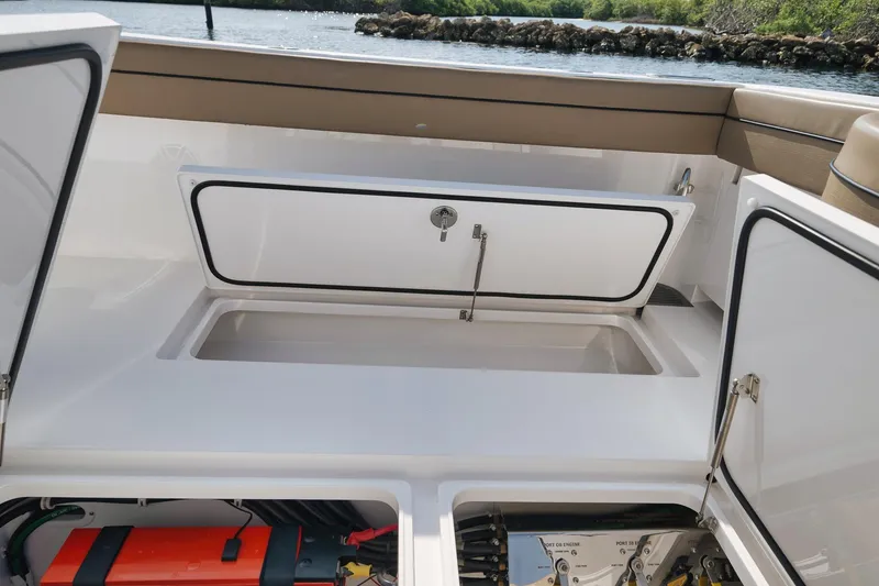 Slide: The Image of 2022 Valhalla Boatworks V-41 storage compartments and engine access. - 58