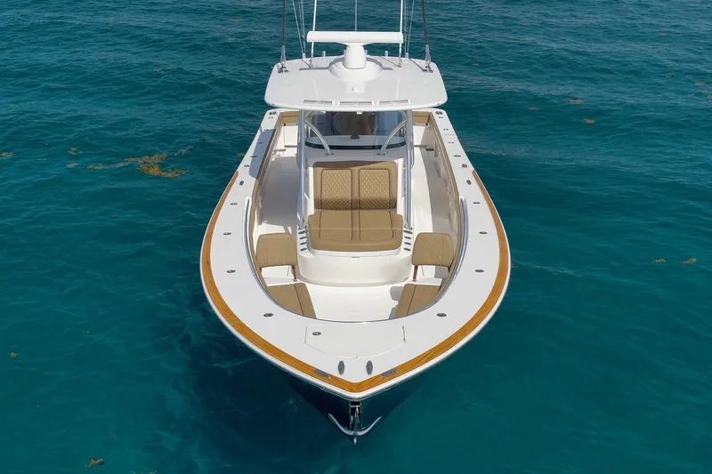 Slide: The Image of 2022 Valhalla Boatworks V-41 on clear blue water, showcasing sleek design and spacious deck. - 6