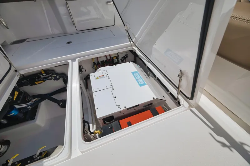 Slide: The Image of 2022 Valhalla Boatworks V-41 engine compartment with electrical components and storage. - 60