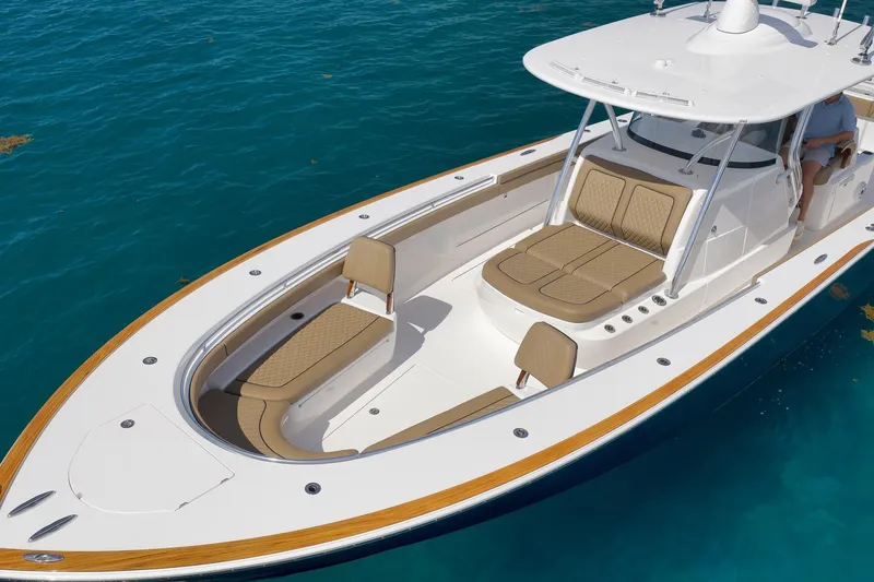Slide: The Image of 2022 Valhalla Boatworks V-41 on clear blue water, showcasing sleek design and seating. - 7