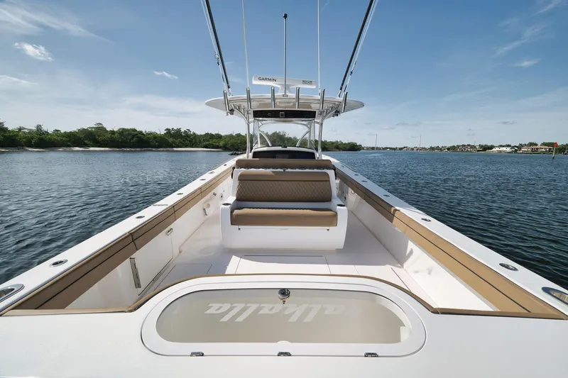 Slide: The Image of 2022 Valhalla Boatworks V-41 on calm water, showcasing spacious deck and seating. - 71