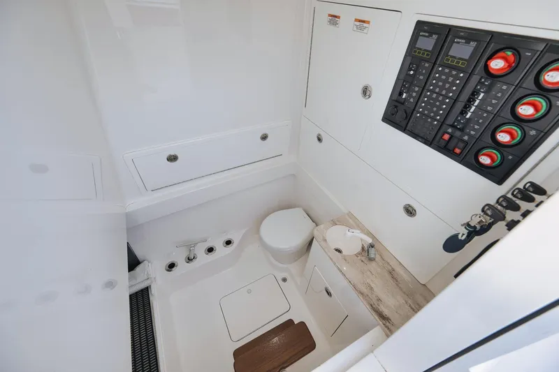 Slide: The Image of 2022 Valhalla Boatworks V-41 interior with control panel and compact bathroom amenities. - 74