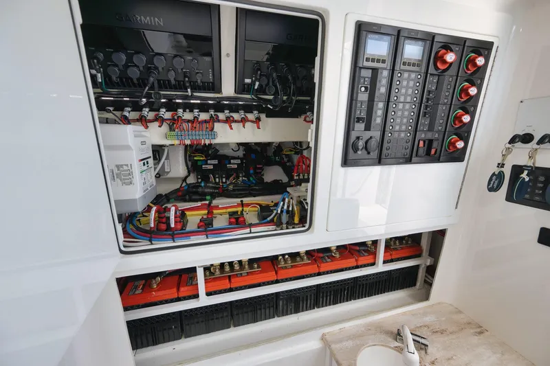Slide: The Image of Electrical panel of 2022 Valhalla Boatworks V-41, showcasing wiring and control systems. - 76