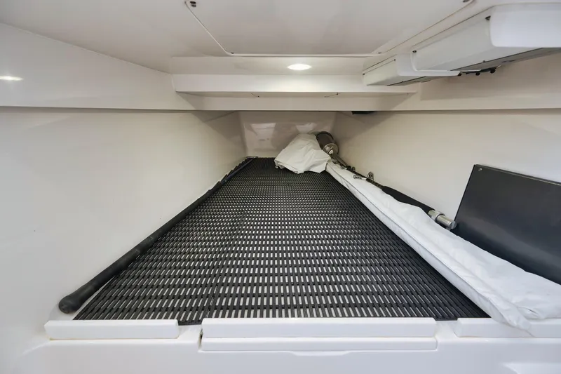 Slide: The Image of 2022 Valhalla Boatworks V-41 interior storage compartment with organized equipment. - 78