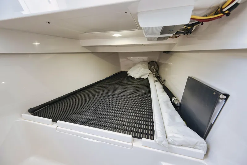 Slide: The Image of 2022 Valhalla Boatworks V-41 interior storage compartment with organized wiring and equipment. - 79